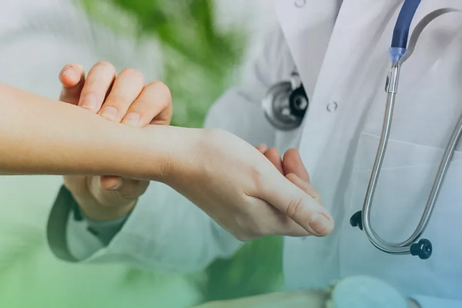 A healthcare professional checking a patient’s pulse